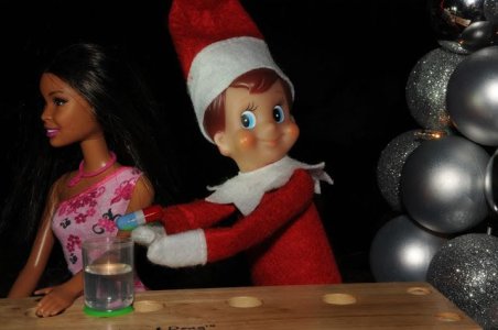 elf-on-shelf-drugging-people.jpg